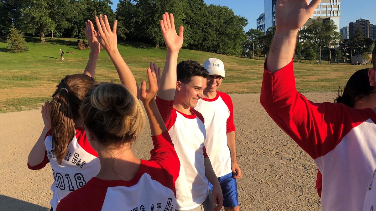 Photo - High Fives all Around - Toronto Annual Summer Student and Litigation Softball Tournament